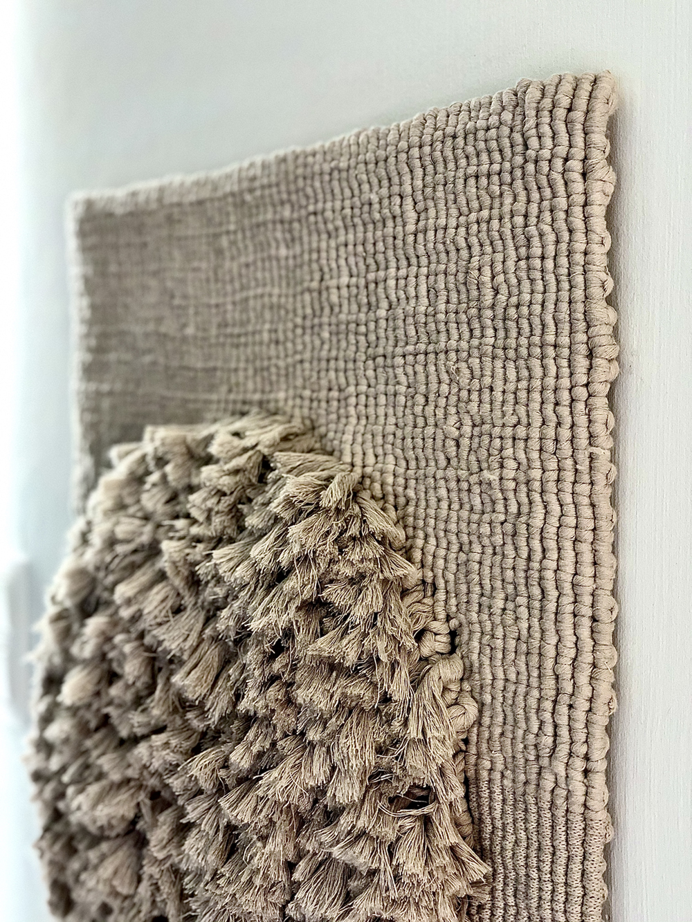 handmade knotted detail of minimalistic macramé unique walldecoration